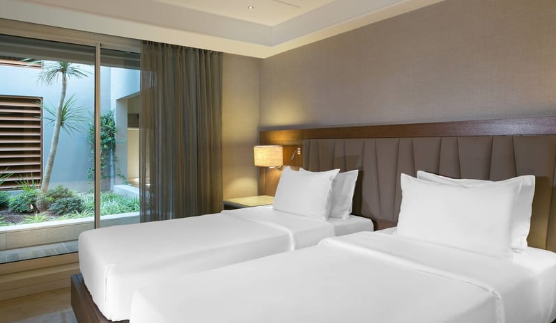 CARESSE HOTEL - TWO BEDROOM SUITE SECOND BEDROOM